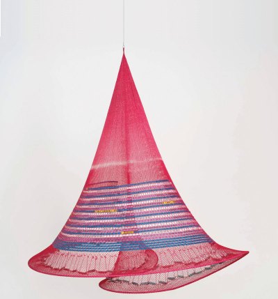 A hanging sculpture made of a pink-dyed fishing net.