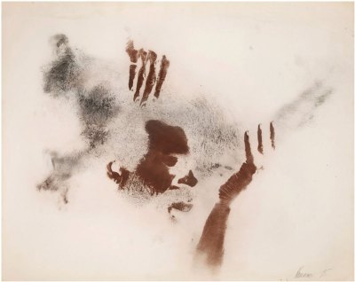 An artwork made of the artist's body imprinted on a piece of paper in shades of black and brown.