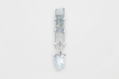 A wall-hung sculpture that resembles part of a spinal column.
