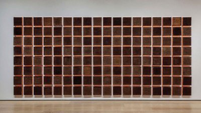 An artwork consisting of grids of 144 bricks of soil from various LA neighborhoods.