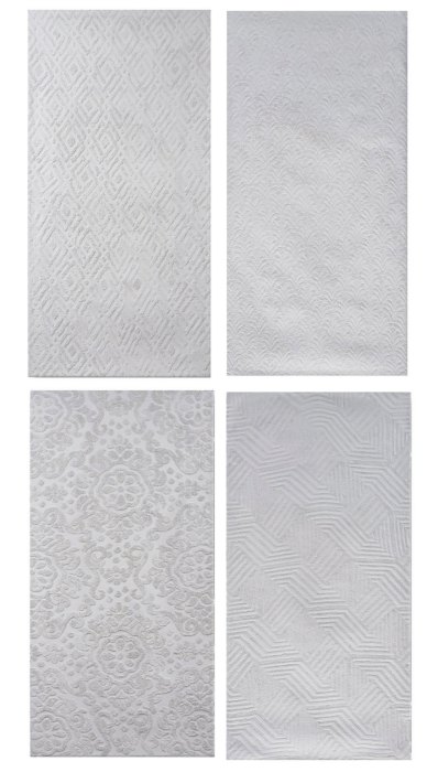 Four paintings that are mostly silver and have delicate patterns.