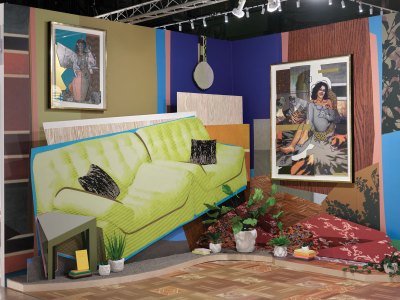 An installation of a living with artworks also in there.