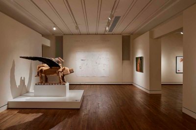 A gallery with sculptures and paintings.