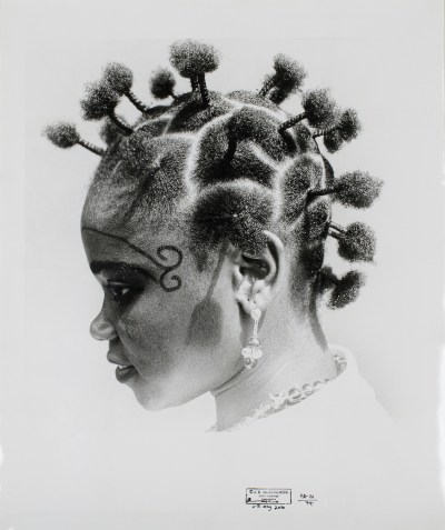 A drawing of a Black woman with her hair in tight knots.