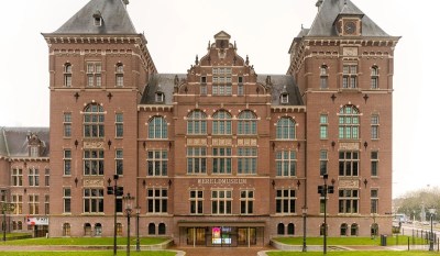 A photo shows the facade of the Wereldmuseum, in Amsterdam, a large brick building