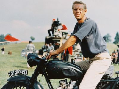 Actor Steve McQueen sitting astride a motorcycle in a publicity still for the 1963 film The Great Escape.