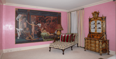 A room with a large painting.