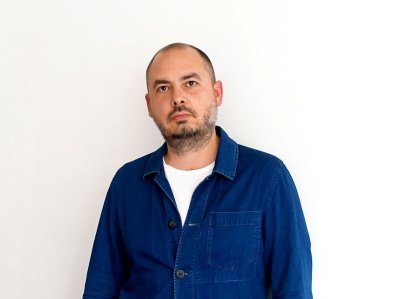 Four people standing on a staircase.