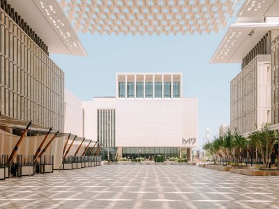 View of a white building, seen across a courtyard, that reads M7.