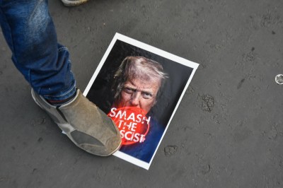 Supporters of the Communist Party of India (CPI(M)) and the Student Federation of India (SFI) take out a protest rally towards the American embassy in Kolkata, India, on January 5, 2026, against the USA's attack on Venezuela and the capture of Venezuela's President Nicolas Maduro and his wife. They stage a demonstration and burn an effigy of Donald Trump during the protest. (Photo by Debarchan Chatterjee/NurPhoto via Getty Images)