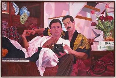 portrait of two men in robes sitting together on the couch with serious expressions and a cat in their lap
